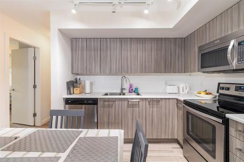 210-881 Academy Way, Kelowna, BC - Indoor Photo Showing Kitchen With Double Sink