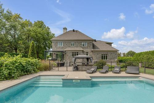 Back facade - 6 Rue Ernest-Trotier, Baie-Saint-Paul, QC - Outdoor With In Ground Pool With Deck Patio Veranda With Backyard