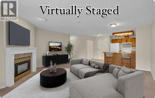 3310 Skaha Lake Road Unit# 306, Penticton, BC - Indoor Photo Showing Living Room With Fireplace