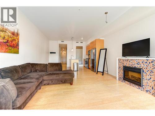1289 Ellis Street Unit# 320, Kelowna, BC - Indoor Photo Showing Living Room With Fireplace