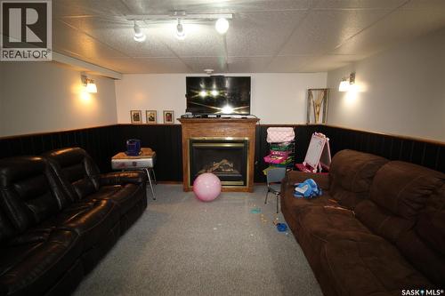 652 9Th Street W, Shaunavon, SK - Indoor Photo Showing Other Room With Fireplace