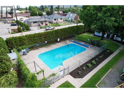 2100 43 Avenue Unit# 205, Vernon, BC - Outdoor With In Ground Pool With Backyard