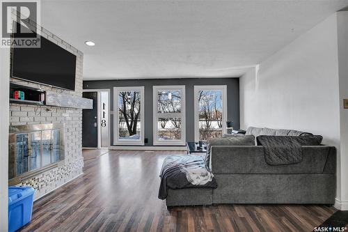 118 N Railway Street W, Warman, SK - Indoor Photo Showing Living Room With Fireplace