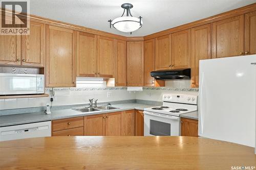 208 1735 Mckercher Drive, Saskatoon, SK - Indoor Photo Showing Kitchen With Double Sink
