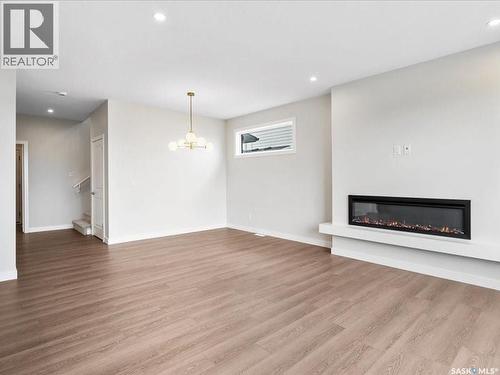 107 Katz Avenue, Saskatoon, SK - Indoor Photo Showing Living Room With Fireplace