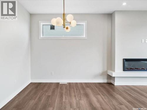 107 Katz Avenue, Saskatoon, SK - Indoor Photo Showing Other Room With Fireplace