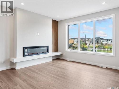 107 Katz Avenue, Saskatoon, SK - Indoor Photo Showing Living Room With Fireplace