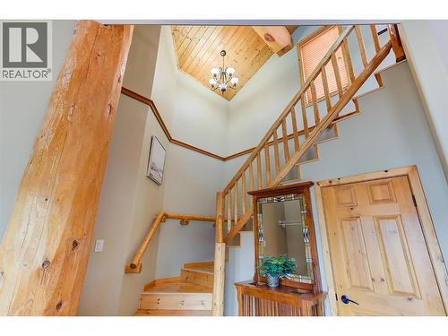 Log beam accents throughout - 7172 Brent Road, Peachland, BC - Indoor Photo Showing Other Room