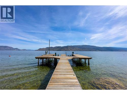 Peachland waterfront estate - 80 feet of shoreline 98' X 46' ft dock with boat lift and 2 sea-doo lifts! - 7172 Brent Road, Peachland, BC - Outdoor With Body Of Water With View