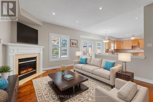 Virtually staged image - 2153 Manor Hill Drive, Mississauga, ON - Indoor Photo Showing Living Room With Fireplace