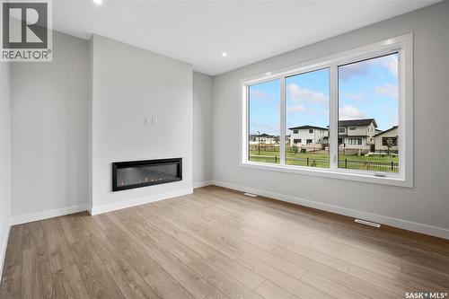 127 Katz Avenue, Saskatoon, SK - Indoor Photo Showing Living Room With Fireplace