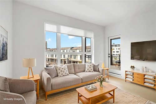 304-3564 A Ryder Hesjedal Way, Colwood, BC - Indoor Photo Showing Living Room