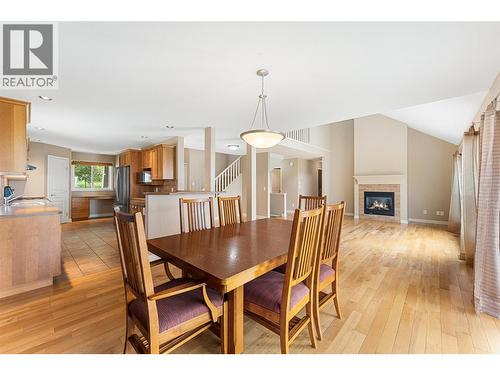 5147 Silverado Place, Kelowna, BC - Indoor Photo Showing Dining Room With Fireplace