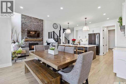 416 Woolf Bend, Saskatoon, SK - Indoor Photo Showing Dining Room With Fireplace