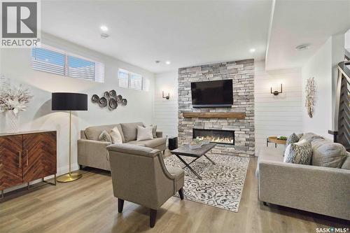 416 Woolf Bend, Saskatoon, SK - Indoor Photo Showing Living Room With Fireplace