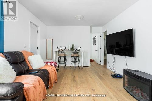 101 River Road E, Wasaga Beach, ON - Indoor Photo Showing Living Room With Fireplace