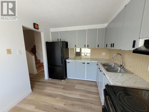 Notice the handy pass through into the dining room - 903J Elmsmere Road, Ottawa, ON - Indoor Photo Showing Kitchen With Double Sink