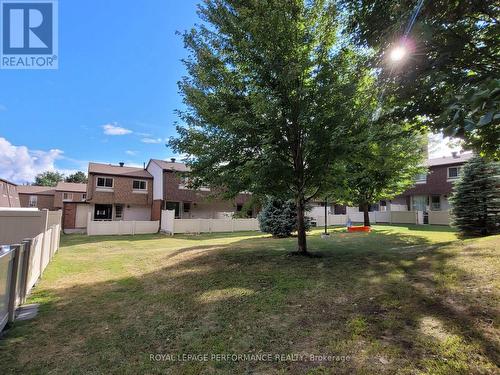 View from the back toward the townhome. - 903J Elmsmere Road, Ottawa, ON - Outdoor