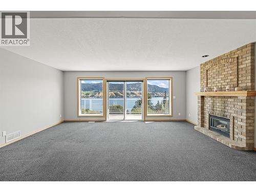 7967 Tronson Road, Vernon, BC - Indoor Photo Showing Living Room With Fireplace