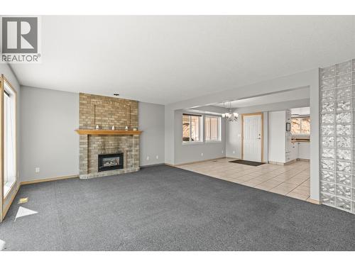 7967 Tronson Road, Vernon, BC - Indoor Photo Showing Living Room With Fireplace