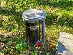 drilled well at south side of driveway - 