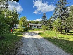 view from driveway - drilled well at red cone - 