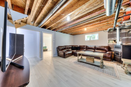 Salle familiale - 162 Rue Du Sanctuaire, Saint-Colomban, QC - Indoor Photo Showing Basement