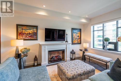213 - 30 Hamilton Street S, Hamilton, ON - Indoor Photo Showing Living Room With Fireplace