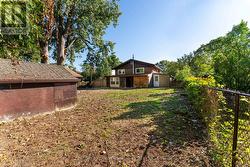 Large Fenced Yard with Detached Garage and Shed - 