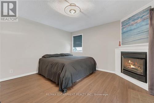 920 Highway 56, Haldimand, ON - Indoor Photo Showing Bedroom With Fireplace
