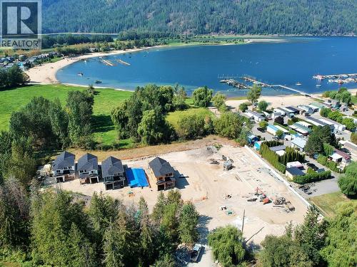 Sunshine Bay Cottages on Mara Lake- Looking West over site - 8200 97A Highway Unit# 8, Mara, BC - Outdoor With Body Of Water With View