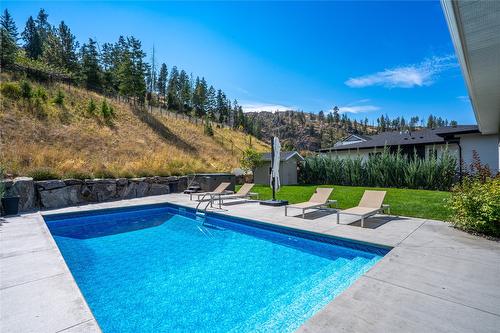 5697 Jasper Way, Kelowna, BC - Outdoor With In Ground Pool With Backyard