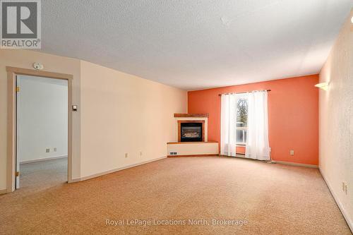 Living Room With Gas Fireplace - 1 - 891 River Road W, Wasaga Beach, ON - Indoor With Fireplace