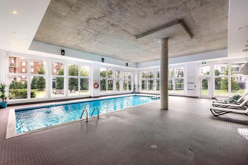 Pool - 102-104-3950 Rue Claude-Henri-Grignon, Montréal (Saint-Laurent), QC - Indoor Photo Showing Other Room With In Ground Pool