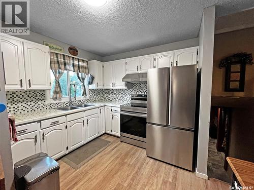 2450 15Th Avenue E, Prince Albert, SK - Indoor Photo Showing Kitchen With Double Sink