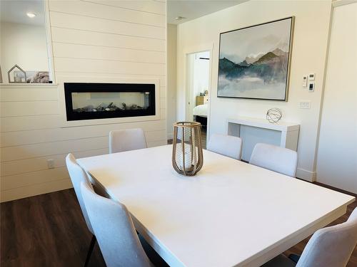 705 Kpokl Road, Invermere, BC - Indoor Photo Showing Dining Room With Fireplace