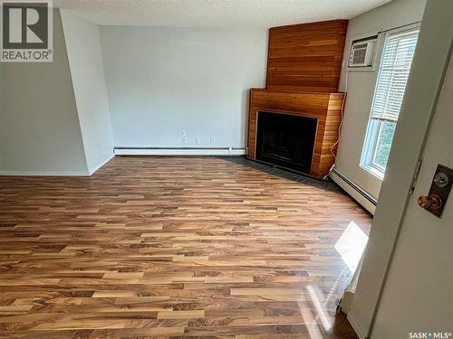 203 423 4Th Avenue N, Saskatoon, SK - Indoor With Fireplace