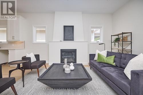 Maple End Model - Finishes may vary - 10 Butternut Crescent, Fort Erie (Ridgeway), ON - Indoor Photo Showing Living Room With Fireplace