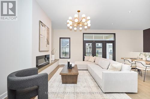 Maple Interior Model - finishes may vary - 11 Butternut Crescent, Fort Erie (Ridgeway), ON - Indoor Photo Showing Living Room With Fireplace