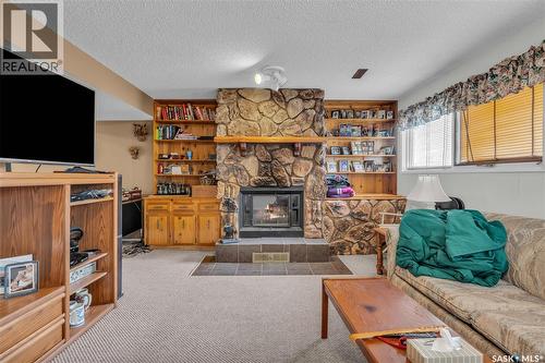 110 Salemka Crescent, Regina, SK - Indoor Photo Showing Living Room With Fireplace