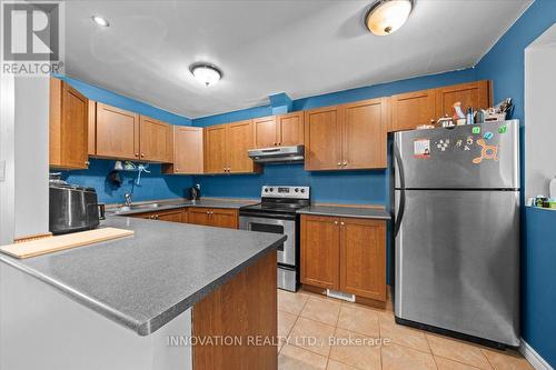 Note the breakfast bar - 82 Stokes Crescent E, Ottawa, ON - Indoor Photo Showing Kitchen