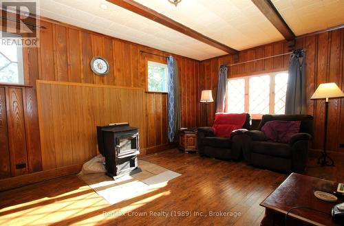 Loads of Natural Light - 11974 Highway 522 Highway, Parry Sound Remote Area (Port Loring), ON - Indoor Photo Showing Living Room With Fireplace