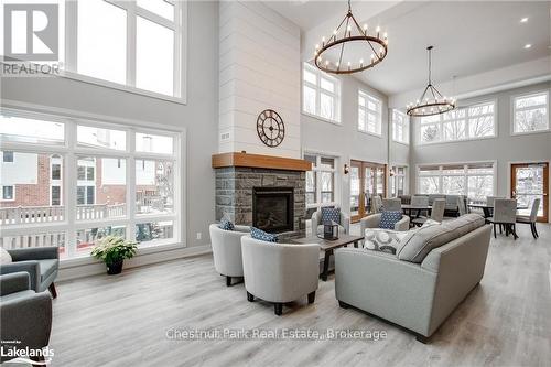 Unparalleled Common Room - 304 - 200 Anglo Street, Bracebridge (Macaulay), ON - Indoor Photo Showing Living Room With Fireplace