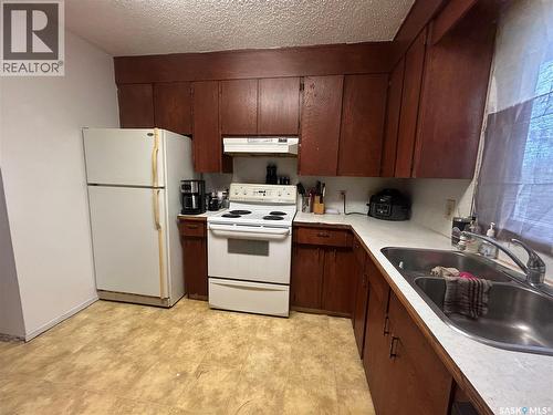 325 White Street, Bienfait, SK - Indoor Photo Showing Kitchen With Double Sink