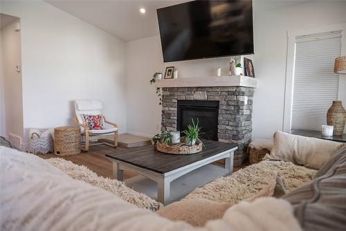 107 18Th Street, Cranbrook, BC - Indoor Photo Showing Living Room With Fireplace