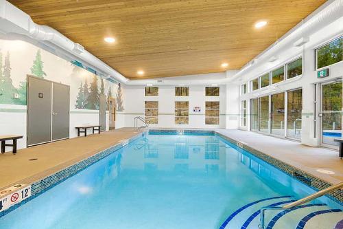 7-3220 Hilltown Drive, Kelowna, BC - Indoor Photo Showing Other Room With In Ground Pool
