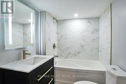 4pc. bathroom in basement; LED back-lit mirror. - 