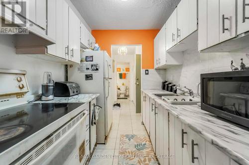 202 - 4692 Crysler Avenue, Niagara Falls (Downtown), ON - Indoor Photo Showing Kitchen With Double Sink