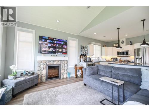 2450 Radio Tower Road Unit# 202, Oliver, BC - Indoor Photo Showing Living Room With Fireplace