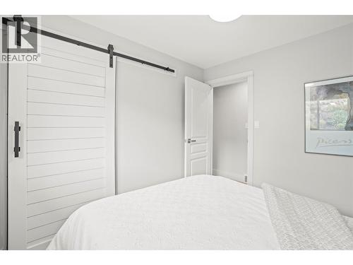 Main level-bedroom #2 - 8990 College Drive, Coldstream, BC - Indoor Photo Showing Bedroom